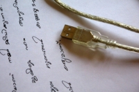 Blogging will enable us to connect better with the people we want to reach in our areas of expertise. Photo: handwriting and a usb cable