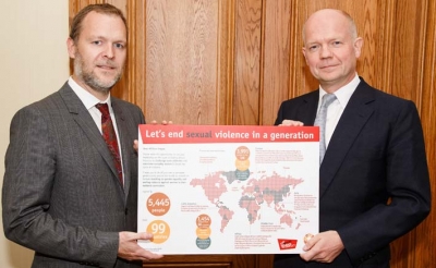 CARE International UK chief executive Laurie Lee presents the CARE petition to William Hague