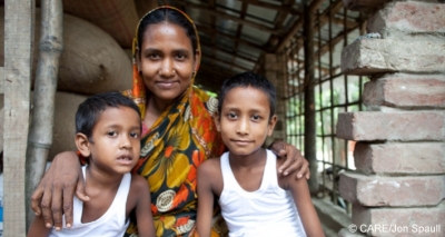 Nargis Pavin, who worked in a factory in India, with two of her children in Botospur, Bangladesh