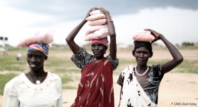 Women carrying seeds distributed by CARE to households in Jonglei, one of the areas most affected by the conflict in South Sudan