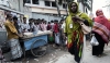 Ruksana Begum, a garment worker in Bangladesh, on her way to the factory