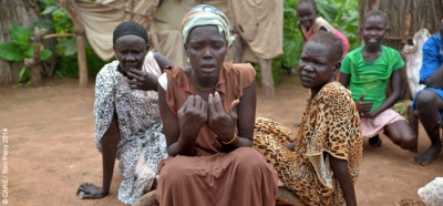 Nyanor Miakoh (centre) walked two days from her hometown of Panyang to Yida, in the far north of South Sudan's Unity State, to escape the violence that saw her lose her home, her livelihood and two members of her family (August 2014)