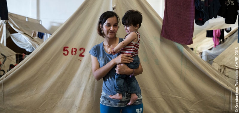 Berivan, from Aleppo, Syria, with her daughter in front of her tent in Vasilika refugee camp, Greece