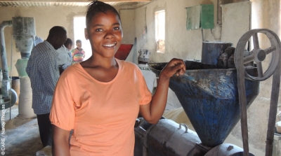 Nyangu Sakala, who was supported by a loan from Lendwithcare, runs a business grinding maize into flour and sunflower seeds into oil