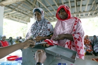 A Village Savings and Loans Association which enables people to access financial services who are normally not able to do so.  &copy; CARE