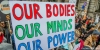 A placard at CARE’s #March4Women event on International Women’s Day 2018