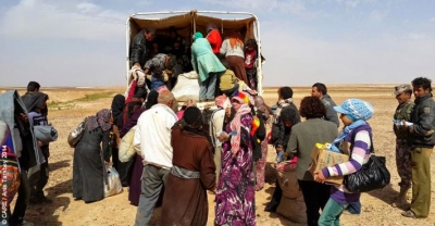Syrian refugees being transferred from the Syrian-Jordanian border
