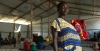 Esther, 21 and pregnant, walked for two weeks to Uganda after an attack on her village in South Sudan